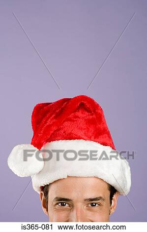Man wearing santa hat View Large Photo Image Stock Image - Man wearing santa hat. Fotosearch