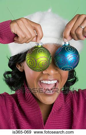 Woman holding baubles View Large Photo Image Stock Photo - Woman holding baubles. Fotosearch