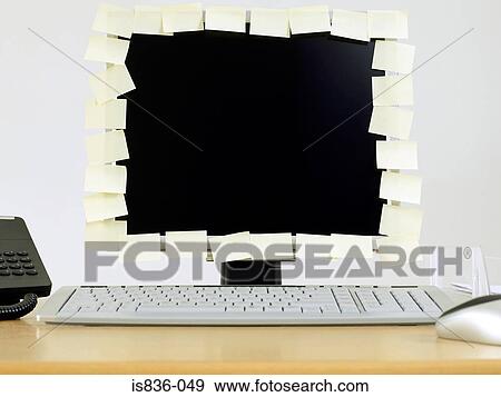 Stock Photo - Adhesive notes covering edge of computer monitor. Fotosearch
