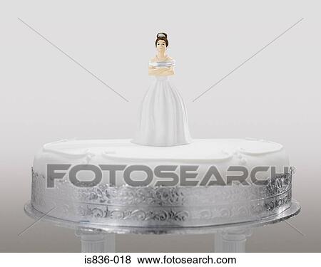 Stock Photo - Angry bride figurine on a wedding cake. Fotosearch