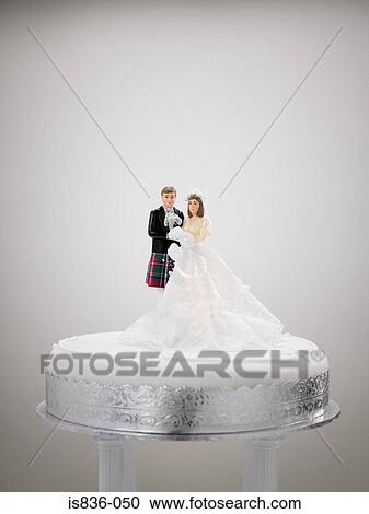 Bride and bridesgroom figurines on a wedding cake View Large Photo Image Stock Image - Bride and bridesgroom figurines on a wedding cake. Fotosearch