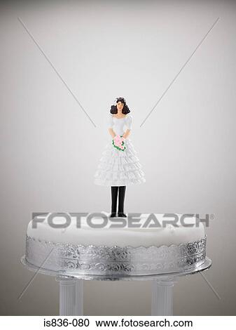 Bride figurine in a wedding dress and trousers View Large Photo Image Stock Image - Bride figurine in a wedding dress and trousers. Fotosearch