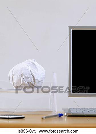 Computer and crumpled paper in a tray View Large Photo Image Stock Photography - Computer and crumpled paper in a tray. Fotosearch