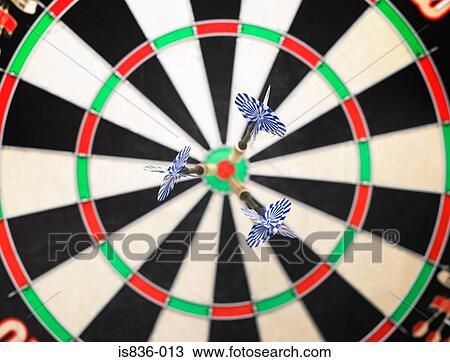 Stock Image - Darts on a dartsboard. Fotosearch