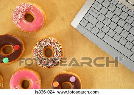 Picture - Doughnuts and a keyboard. Fotosearch