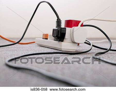 Stock Photo - Plugs in a socket. Fotosearch