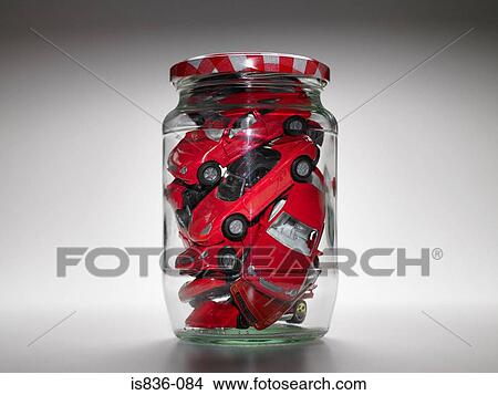 Toy cars inside a jam jar View Large Photo Image Picture - Toy cars inside a jam jar. Fotosearch