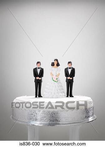 Stock Image - Wedding figurines on a wedding cake. Fotosearch