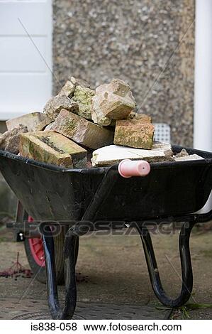 Bricks in a wheelbarrow View Large Photo Image Stock Photo - Bricks in a wheelbarrow. Fotosearch