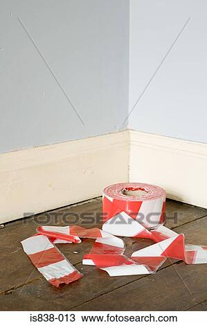 Stock Image - Cordon tape in corner of room. Fotosearch