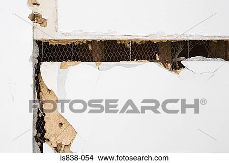 Damaged plasterboard wall View Large Photo Image Picture - Damaged plasterboard wall. Fotosearch