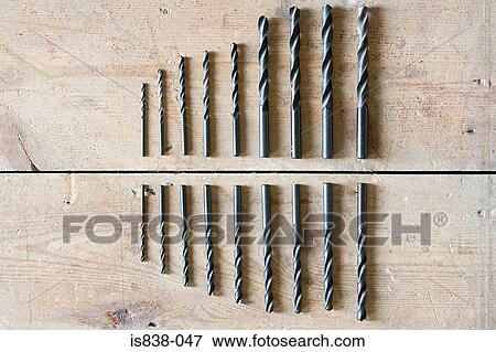 Drill bits on floorboards View Large Photo Image Stock Photo - Drill bits on floorboards. Fotosearch