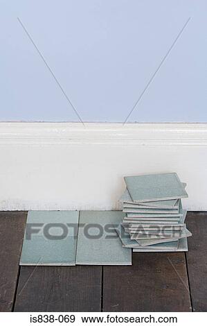 Floor tiles on floorboards View Large Photo Image Stock Photo - Floor tiles on floorboards. Fotosearch