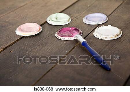 Lids with paint and paintbrush View Large Photo Image Stock Photo - Lids with paint and paintbrush. Fotosearch