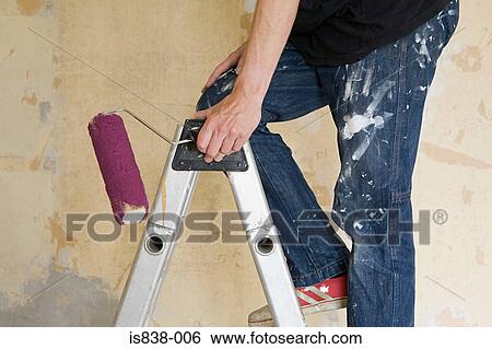 Man on stepladder with paint roller View Large Photo Image Stock Photograph - Man on stepladder with paint roller. Fotosearch