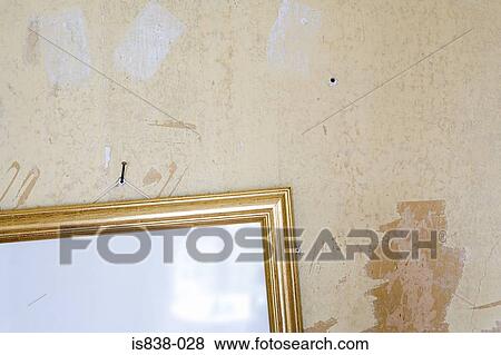Stock Photo - Mirror hanging on a wall. Fotosearch