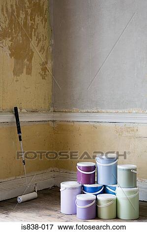 Paint roller and paint pots in room View Large Photo Image Stock Photo - Paint roller and paint pots in room. Fotosearch