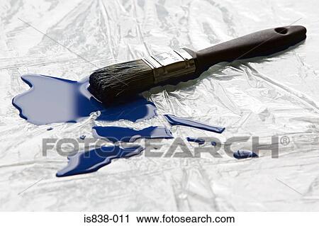 Stock Image - Paintbrush and blue paint. Fotosearch