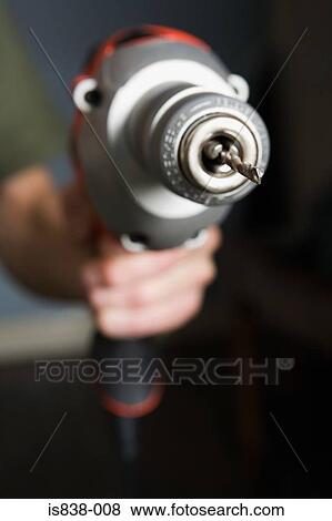 Person with a power drill View Large Photo Image Stock Photo - Person with a power drill. Fotosearch