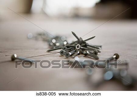 Screws on the floor View Large Photo Image Stock Photography - Screws on the floor. Fotosearch