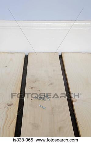Stock Photography - Screws on the floor. Fotosearch