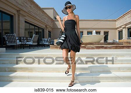 Stock Photography - Stylish woman on steps. Fotosearch