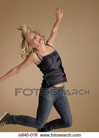 Woman jumping View Large Photo Image Stock Photo - Woman jumping. Fotosearch