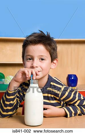 Stock Image - Boy drinking milk. Fotosearch