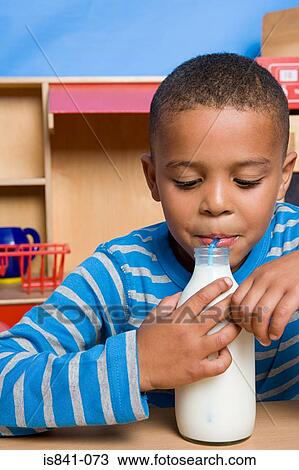 Stock Image - Boy drinking milk. Fotosearch