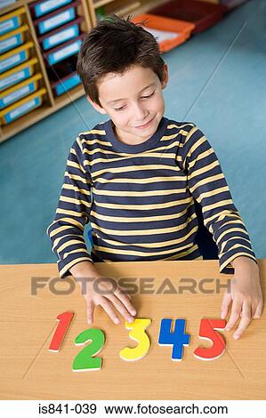 Boy learning numbers View Large Photo Image Stock Photo - Boy learning numbers. Fotosearch