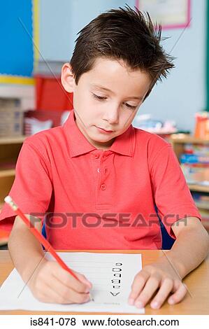 Boy writing alphabet View Large Photo Image Stock Photo - Boy writing alphabet. Fotosearch