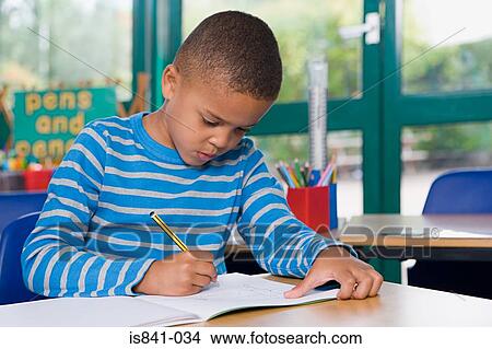Picture - Boy writing. Fotosearch