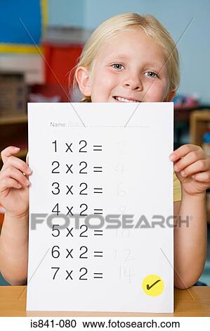 Girl holding exam paper View Large Photo Image Stock Image - Girl holding exam paper. Fotosearch