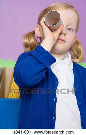 Girl looking through a toilet roll View Large Photo Image Stock Photo - Girl looking through a toilet roll. Fotosearch