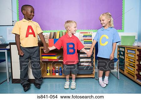 Primary school students holding hands View Large Photo Image Picture - Primary school students holding hands. Fotosearch
