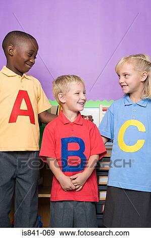Three primary school students View Large Photo Image Stock Photo - Three primary school students. Fotosearch