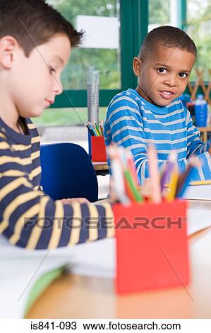 Stock Image - Two boys in a lesson. Fotosearch