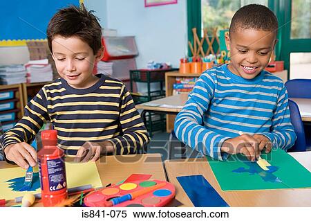 Two boys painting View Large Photo Image Stock Photography - Two boys painting. Fotosearch