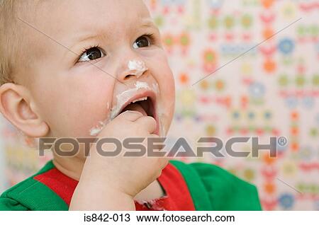 Baby with a messy face View Large Photo Image Stock Image - Baby with a messy face. Fotosearch