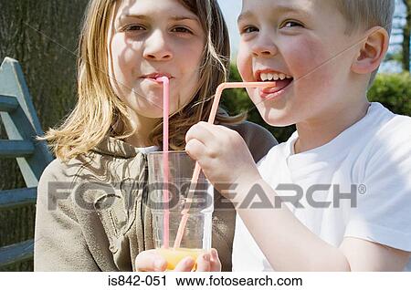 Boy and girl sharing drink View Large Photo Image Stock Image - Boy and girl sharing drink. Fotosearch