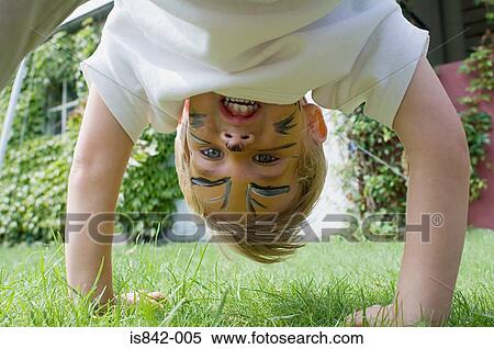 Boy playing in garden View Large Photo Image Stock Photography - Boy playing in garden. Fotosearch