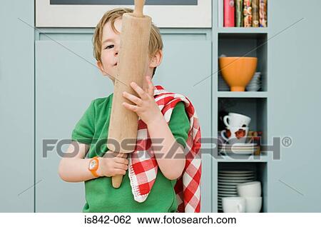 Boy with a rolling pin View Large Photo Image Stock Image - Boy with a rolling pin. Fotosearch