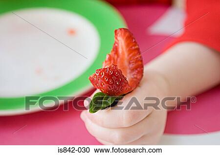 Child with strawberry View Large Photo Image Stock Image - Child with strawberry. Fotosearch