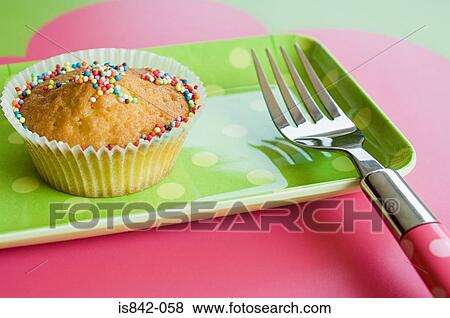 Cupcake and fork View Large Photo Image Stock Photo - Cupcake and fork. Fotosearch