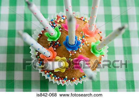 Cupcake with birthday candles View Large Photo Image Stock Photo - Cupcake with birthday candles. Fotosearch