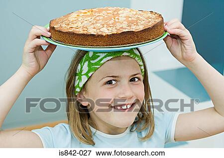 Girl with a cake on her head View Large Photo Image Stock Photo - Girl with a cake on her head. Fotosearch