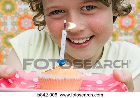 Girl with birthday cupcake View Large Photo Image Stock Photograph - Girl with birthday cupcake. Fotosearch