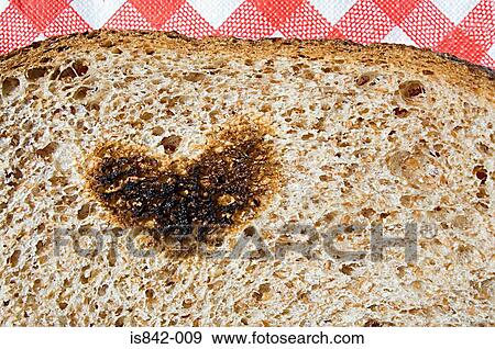 Heart shape burnt on toast View Large Photo Image Stock Photo - Heart shape burnt on toast. Fotosearch