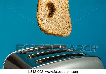 Toast with heart shape burn and toaster View Large Photo Image Stock Image - Toast with heart shape burn and toaster. Fotosearch