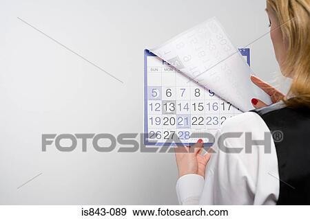 Businesswoman holding calendar View Large Photo Image Stock Photo - Businesswoman holding calendar. Fotosearch